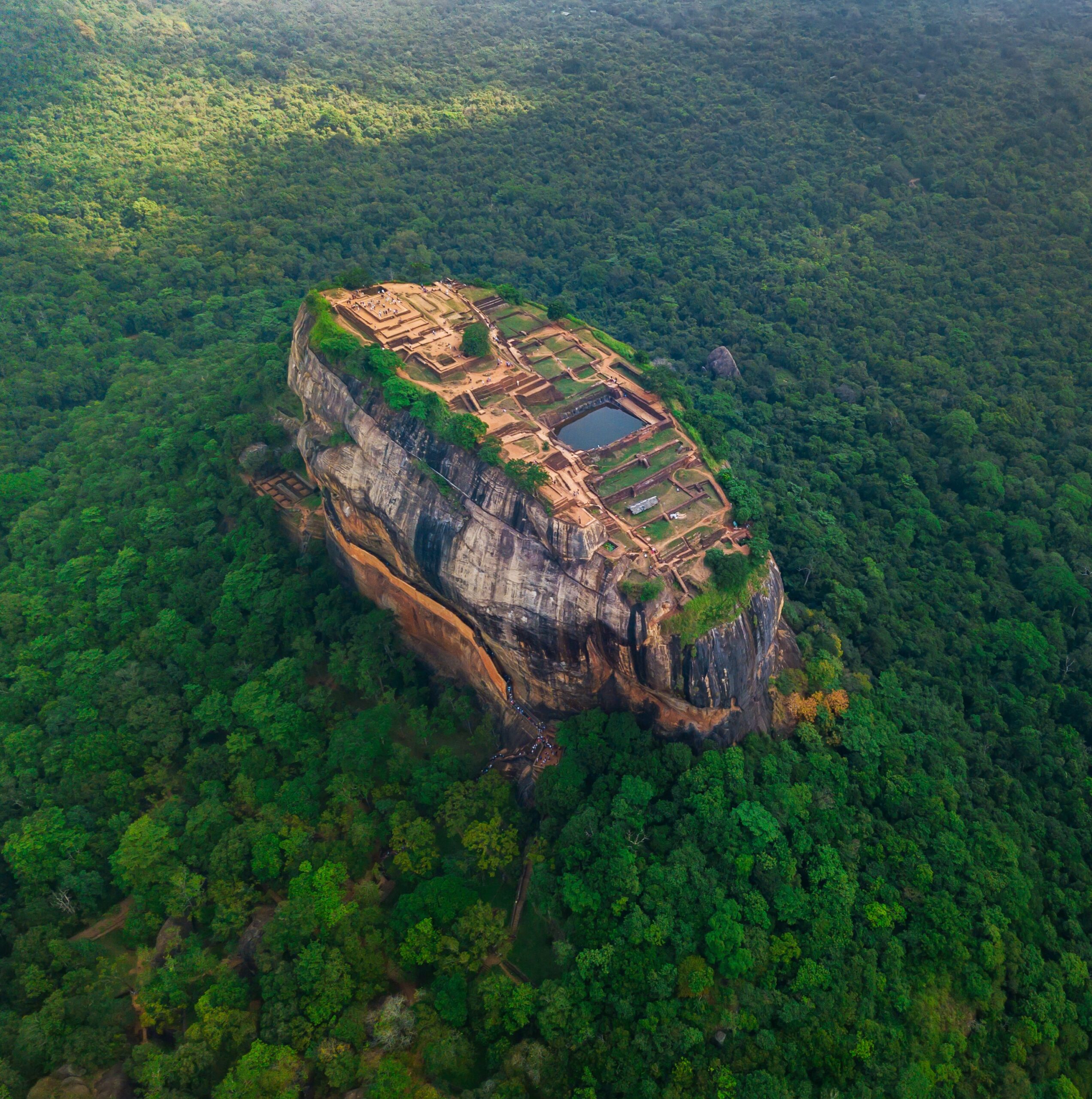 Aerial view of Sigiriya rock at misty morning, Sri Lanka. Drone footage.